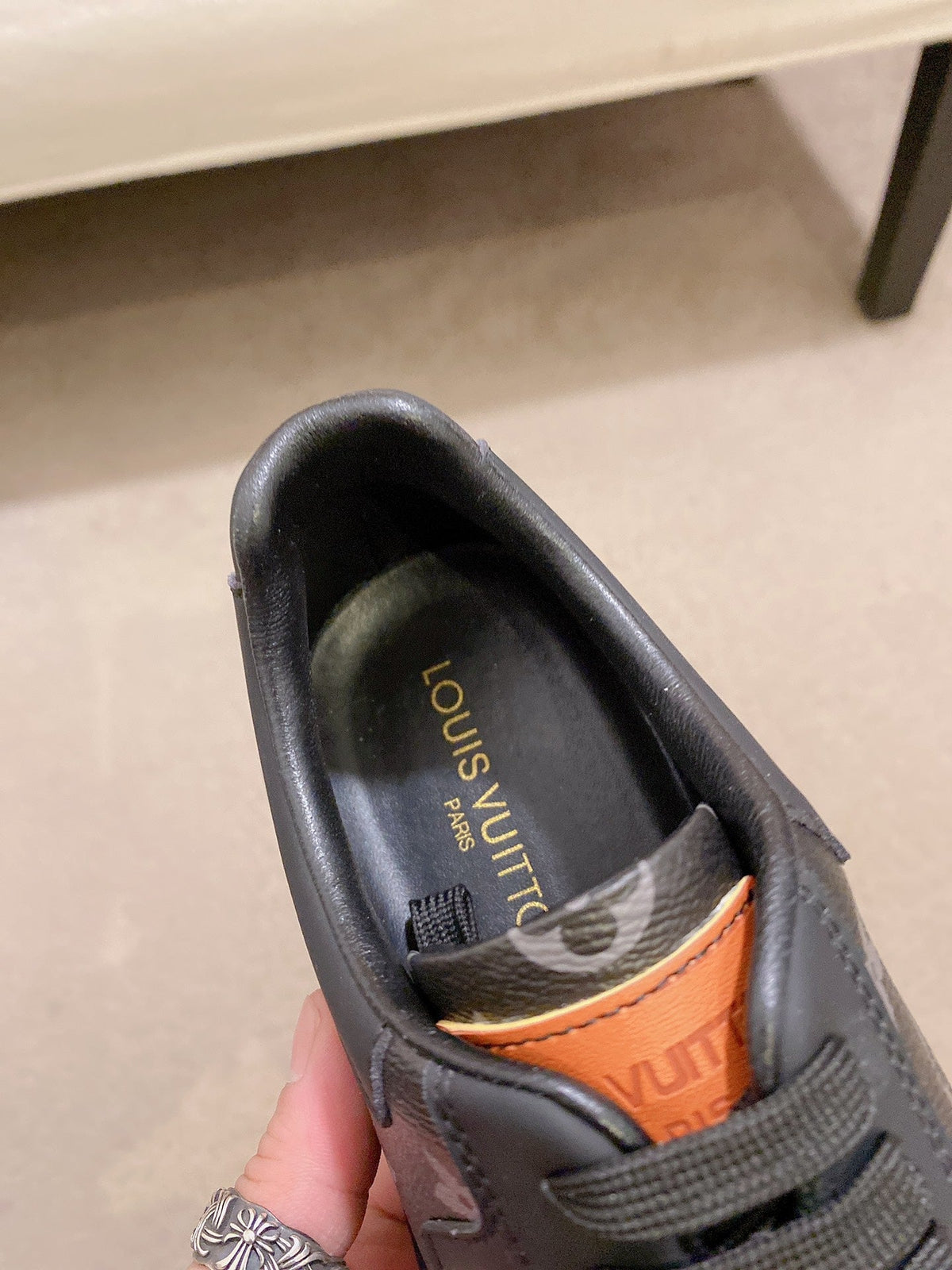 LV TRAINER IN BLACK MIX DARK BROWN CALFSKIN