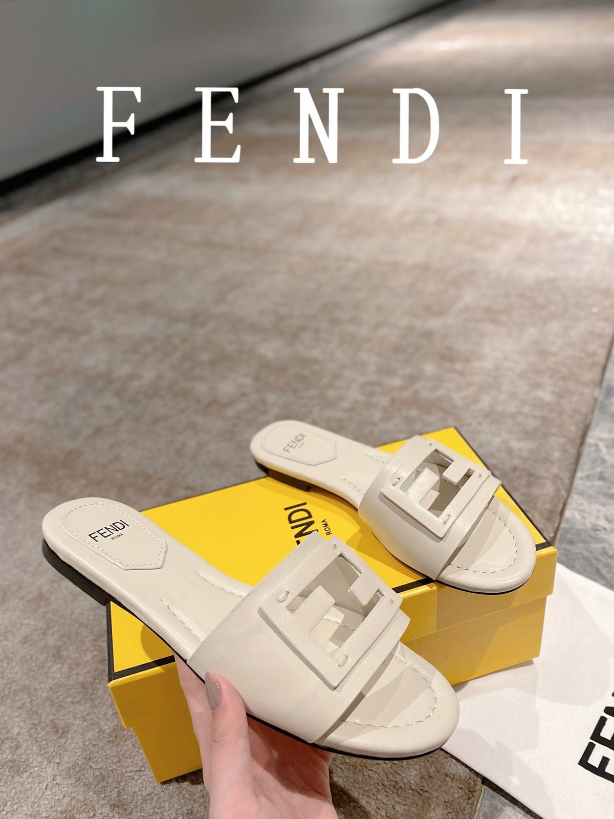 FENDI BAGUETTE SLIDES IN WHITE LAMBSKIN