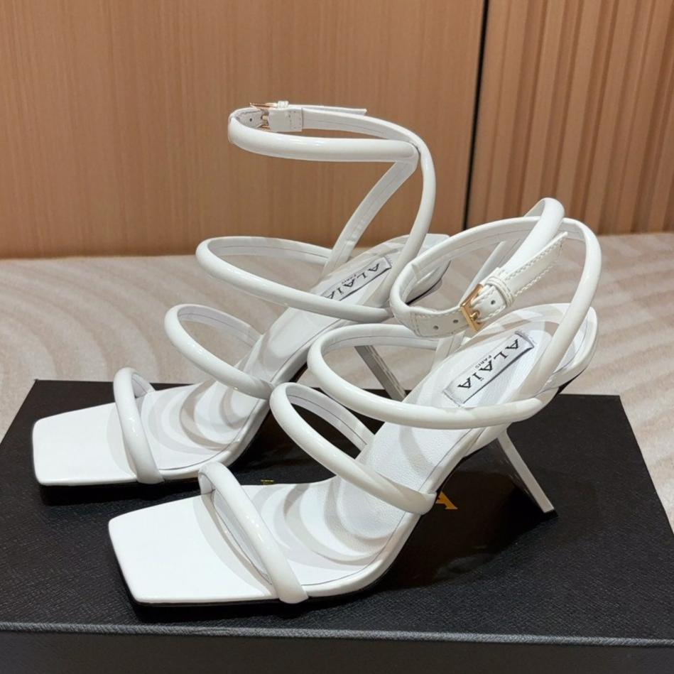 ALAIA THREE-STRAPS HIGH HEEL SANDALS IN WHITE PATENT LAMBSKIN