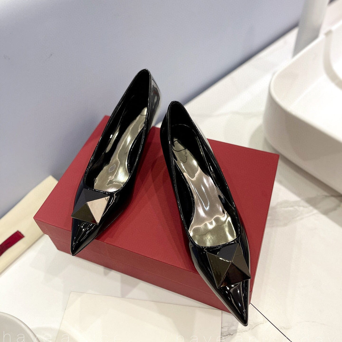 One Stud Black Patent Black Leather Pump