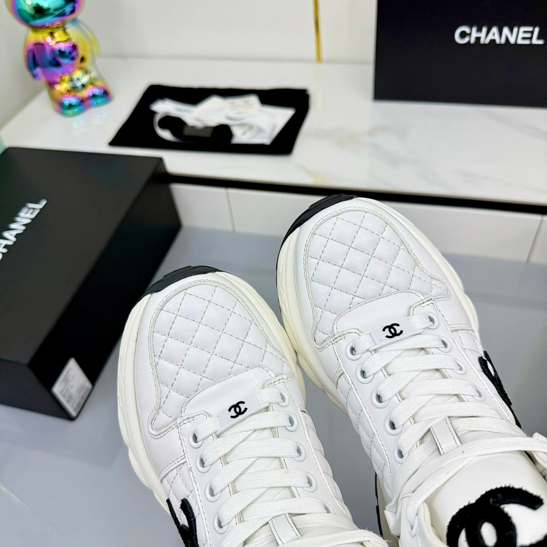 Chanel 2025 Quilted High-Top Sneakers White Black Cowhide 469790
