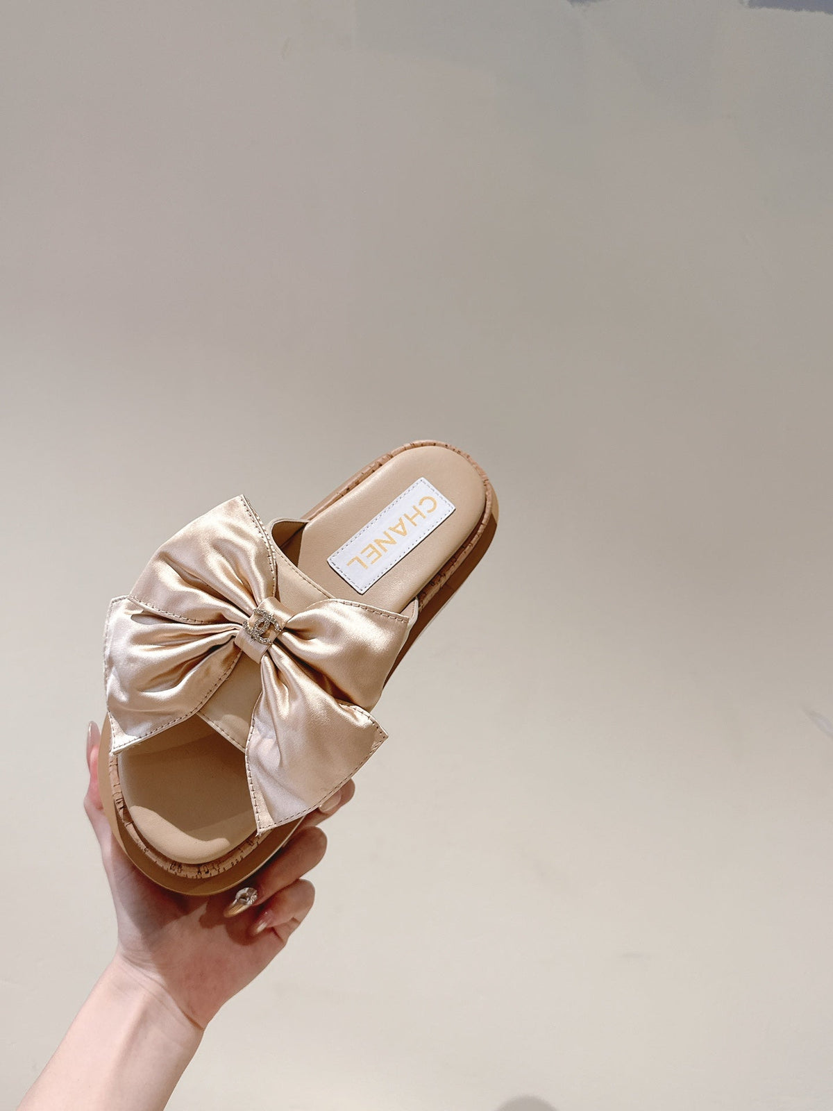 CC SLIPPERS WITH SILK BOW IN BEIGE ALMOND COWHIDE