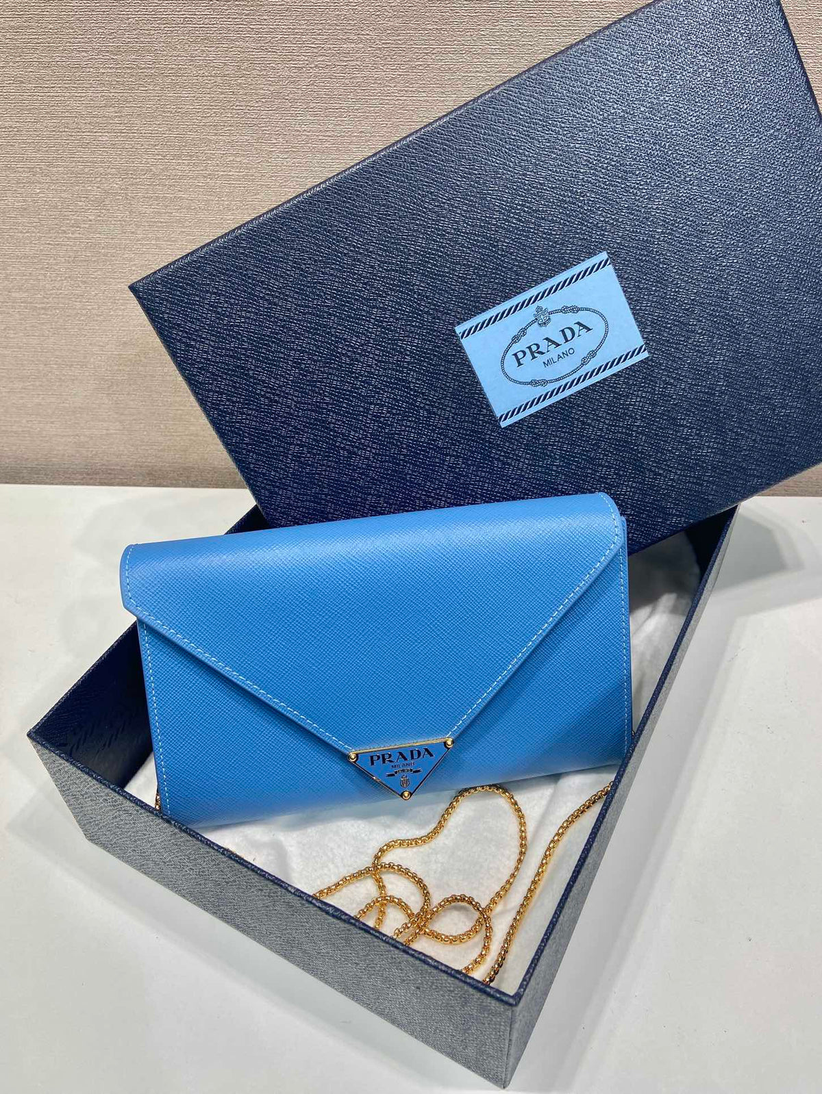 PRA Cross pattern envelope bag blue leather 341158