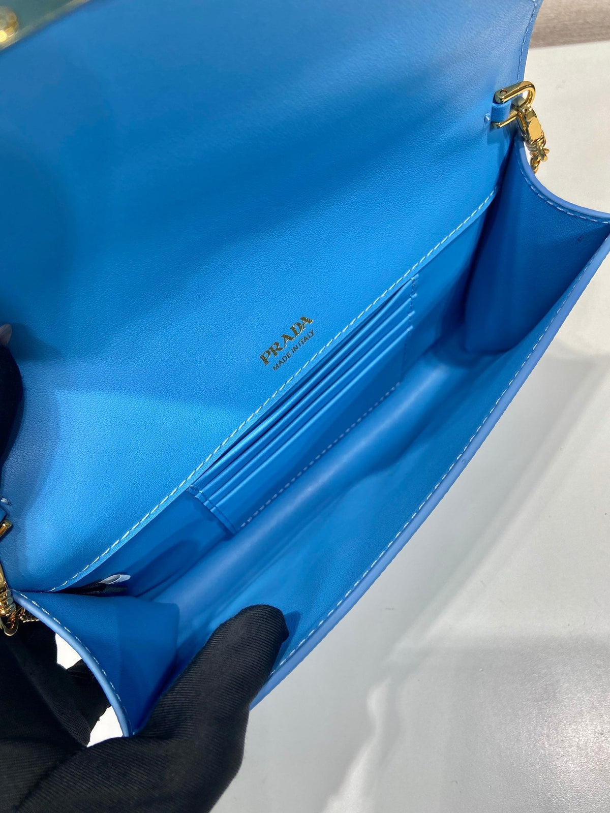 PRA Cross pattern envelope bag blue leather 341158