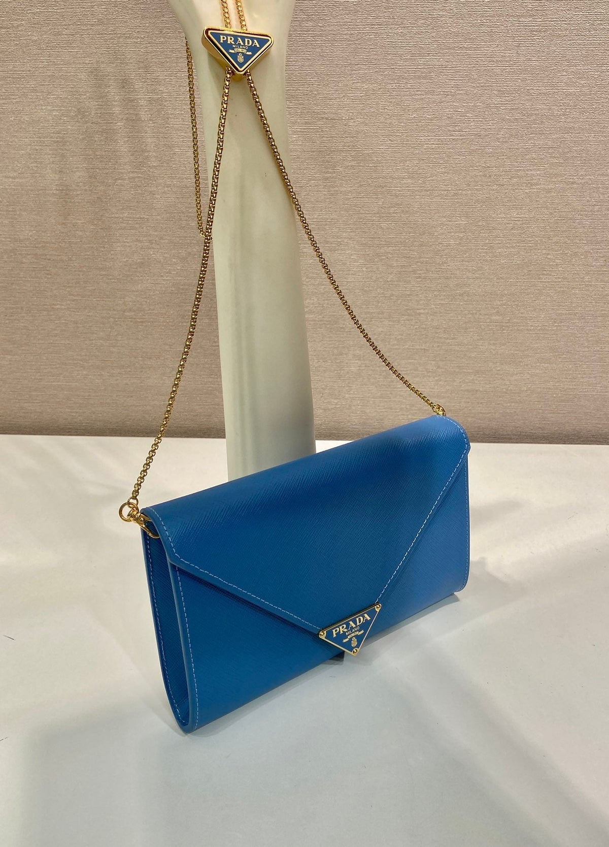 PRA Cross pattern envelope bag blue leather 341158