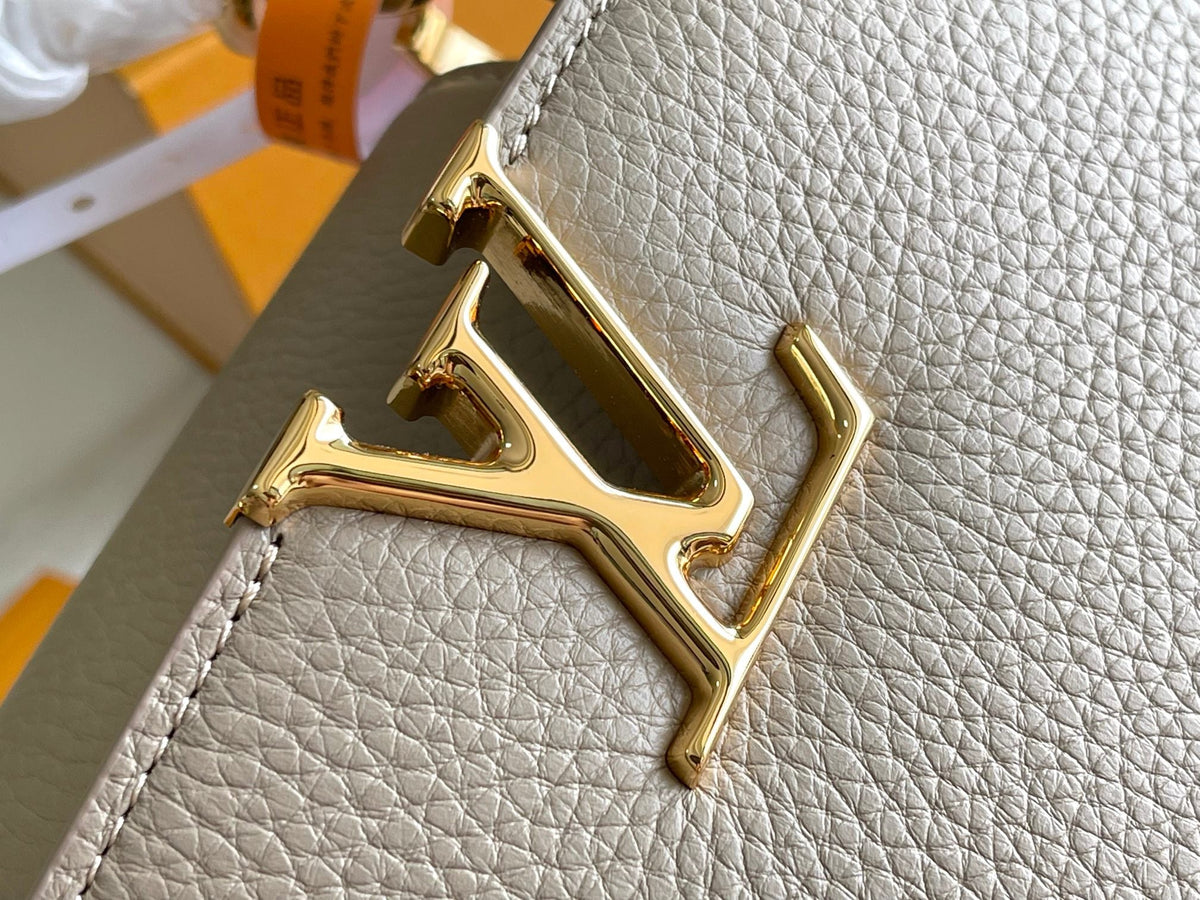 CAPUCINES BB 27 DARK BEIGE TAURILLON GOLD HARDWARE