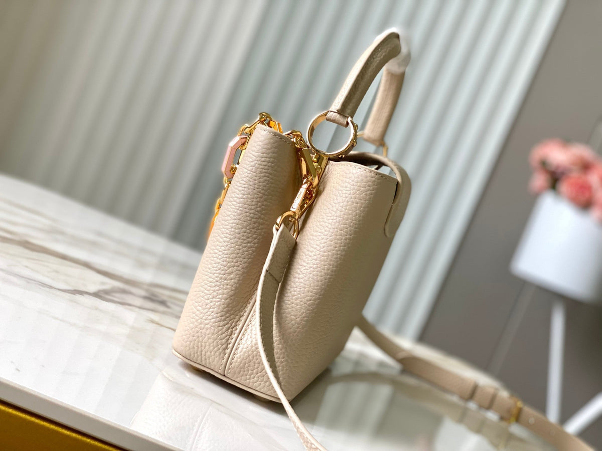 CAPUCINES BB 27CM BEIGE TAURILLON LEATHER