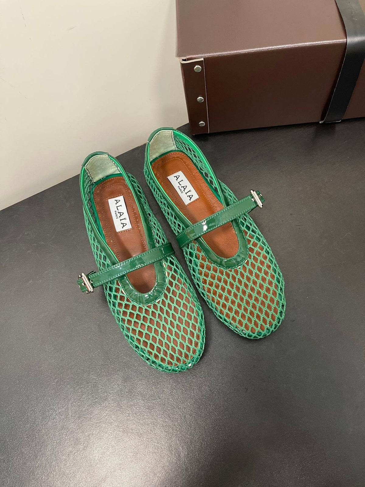 ALAIA BALLET FLATS IN COOL GREEN MESH FISHNET