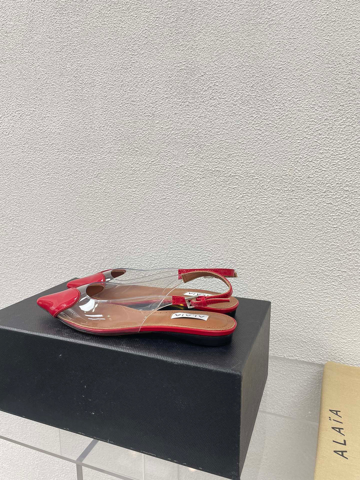 ALAIA LE COEUR FLAT SLINGBACKS IN CHERRY RED PATENT LAMBSKIN