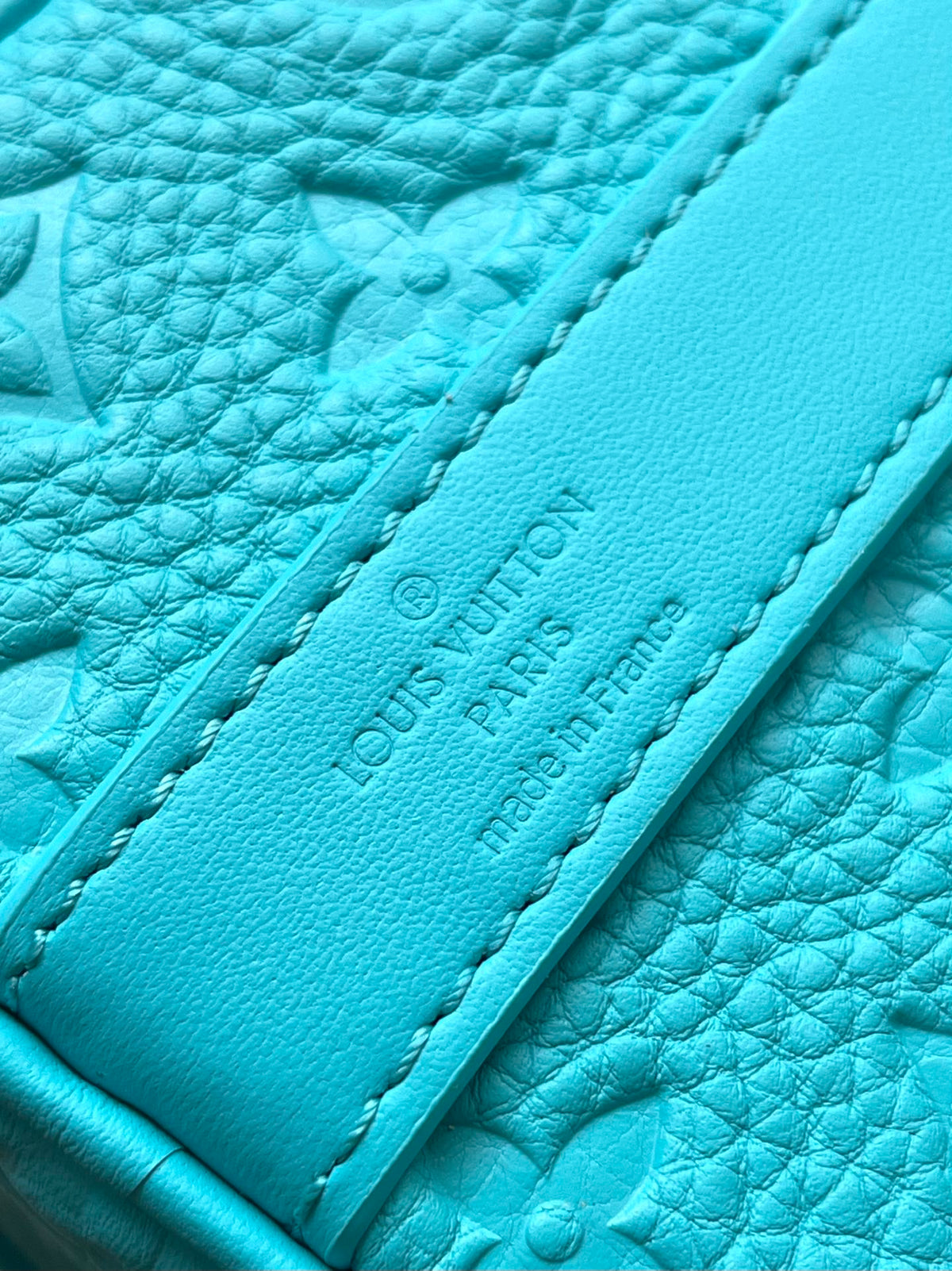 KEEPALL BANDOULIÈRE 25 IN TURQUOISE BLUE MONOGRAM EMBOSSED CALFSKIN