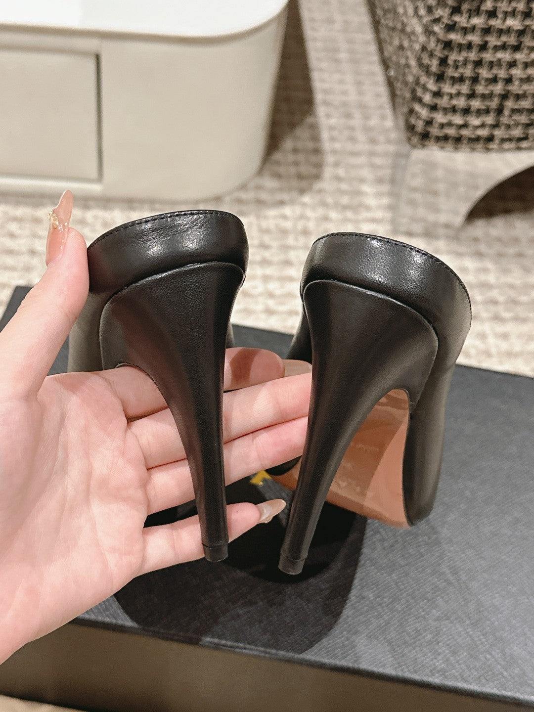 ALAIA SPIKE JEWEL MULES IN BLACK CALFSKIN