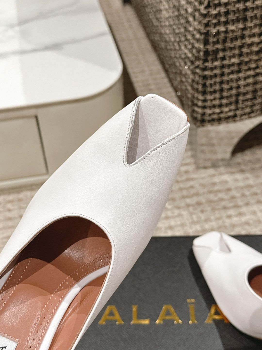 ALAIA SPIKE JEWEL MULES IN WHITE CALFSKIN