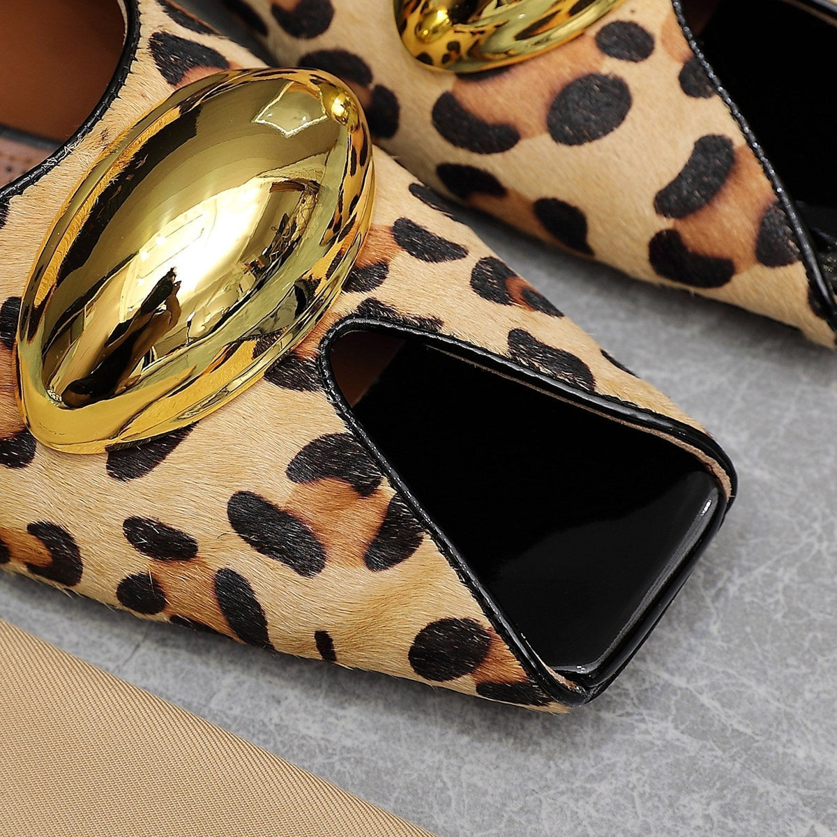 ALAIA FLAT MULE IN LEOPARD LAMBSKIN WITH GOLD HARDWARE